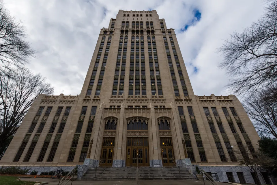 View looking up at high-rise Art Deco Atlanta City Hall building.